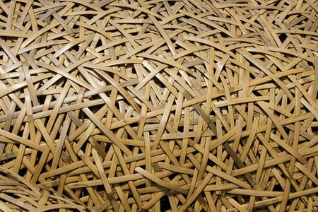 Bamboo that has been woven into a sculpture.  This close up shows the detail and pattern created by this sculpture.の写真素材
