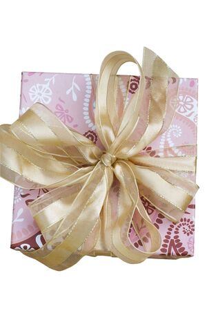 A present, isolated against a white background. The present is beautiful wrapped with a golden bowの写真素材