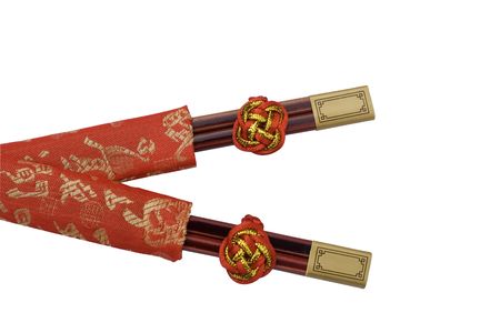 These are two pairs of chopsticks given out at a Chinese Wedding.  The red color is for good luck.  の写真素材
