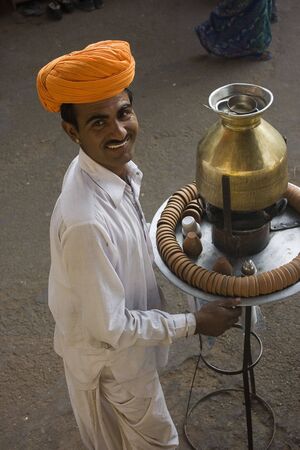 Pushkar, India, January, 22, 2008;  An Indian Chai Wallah with his mobile Tea Service.  Tea is an essential part of Indian Culture.のeditorial素材