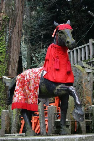 A Bronze Horse at a shrine in Japan.  This is at Fushimi-inari, an area with numerous Shinto shrines, Japan's original religion.の写真素材