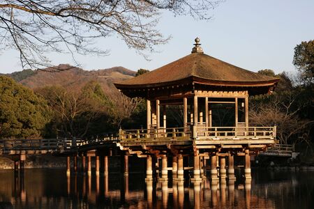 This is pavilion on a lake at Nara, Japan. It's a great place to relax and enjoy the sunset.の写真素材