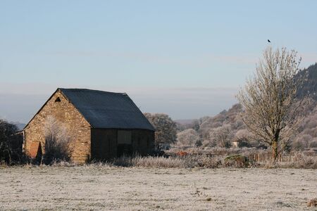 Wintry rural landscape with a blue sky.  The ice came from freezing fog.  の写真素材