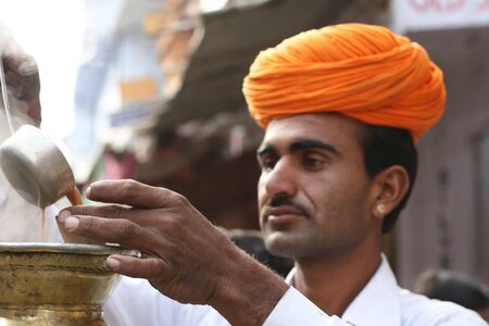 Pushkar, India, January, 22, 2008;  An Indian Chai Wallah with his mobile Tea Service.  Tea is an essential part of Indian Culture.のeditorial素材