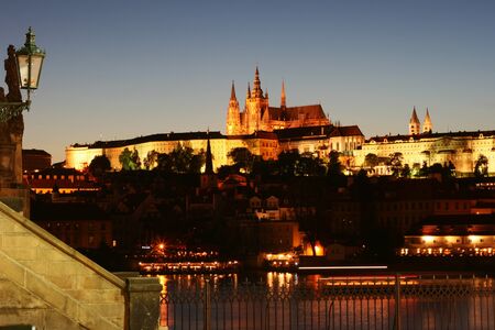 Prague castle and the side of Charles Bridge at night.の写真素材