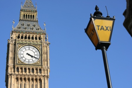 Taxi in London.  Big Ben is in the background.の写真素材