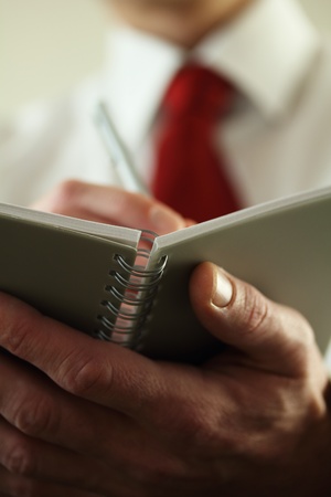 Business man or Office worker taking important notesの写真素材