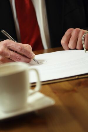 Business man signing a contract   Official work の写真素材