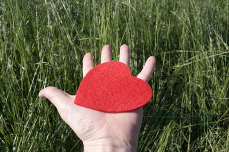 A man with heart on his handの写真素材