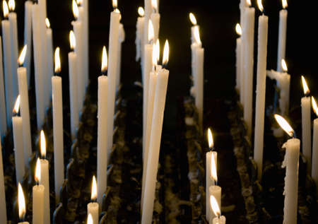 Cluster of candles in churchの写真素材