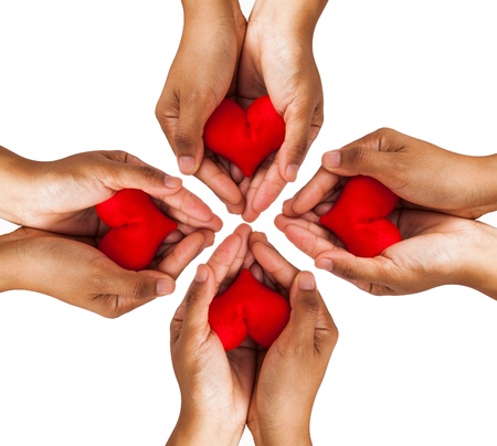 Conceptual symbol of love with hand and  heart isolated on white backgroundの写真素材
