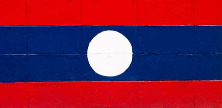 Laos flag painted on a brick wallの写真素材