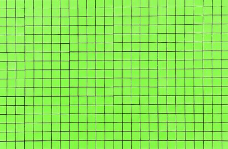 green mosaic tile texture with white fillingの写真素材