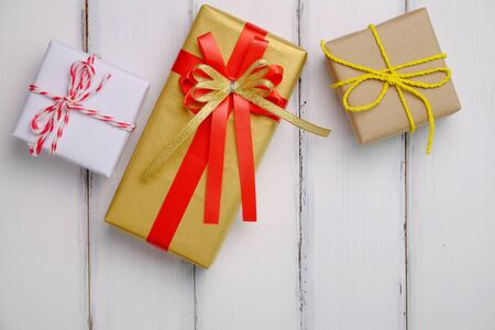 Beautiful gift box in important day on white wood  background vintange style, top view.の写真素材