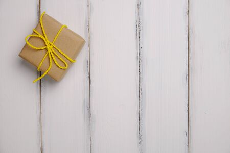 Beautiful gift box in important day on white wood  background vintange style, top view.の写真素材