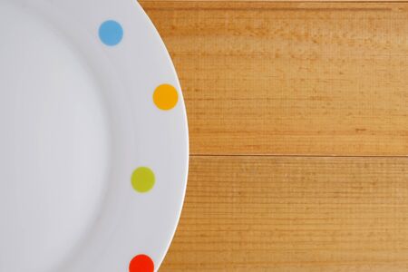 Top view of blank dish on wood table background with space.