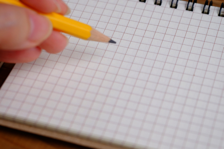 Blank open notebook and writing on wood table background concept, top view and blank spaec.の写真素材