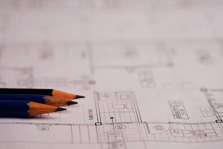 Pencil over house plan blueprints concept. Business concept of architect, designer and builder with draws a plan and design, selective focus.の写真素材