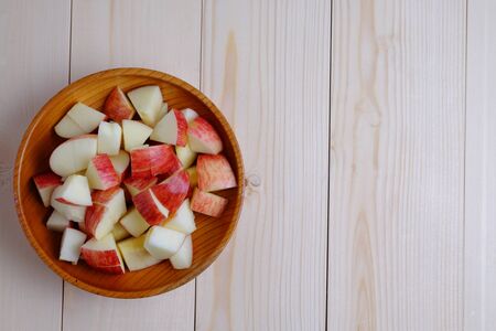Top view of red apple isolated style on wooden cup and wood table. Blank space, background and vintage.の写真素材