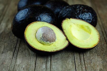 Close up of Avocado on wood table background. Healthy food concept.の写真素材