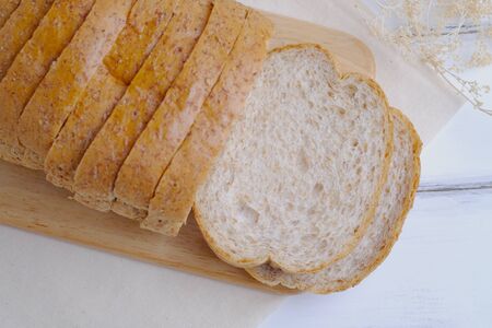 Top view of Whole grain bread isolated on wooden background, space and selective focus.