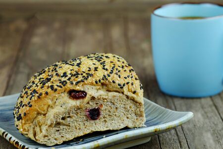 Healthy bread with sesame seed on plate and wood table background, Selective focus, breakfast and...