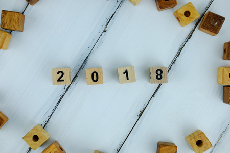 Top view of number 2018 on white wood background concept, happy new year day.の写真素材