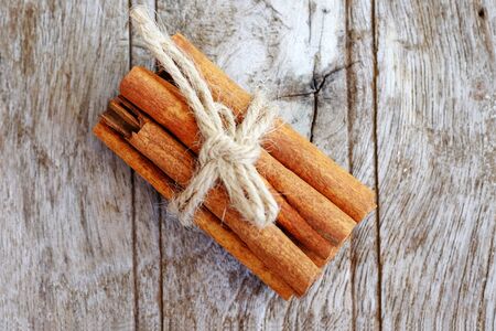 Healthy of Cinnamon on wooden background, top view and healthy food.