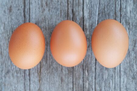 Healthy of eggs on wooden background concept, selective focus, top view style.の写真素材