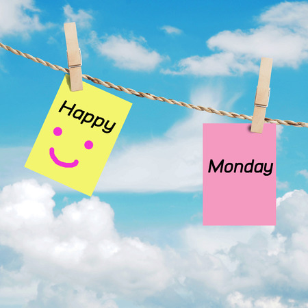 Happy monday on color paper on line in front of blue sky concept.の写真素材