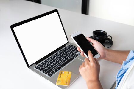 Image of business woman office leader holding credit card and using laptop for online shopping.の写真素材