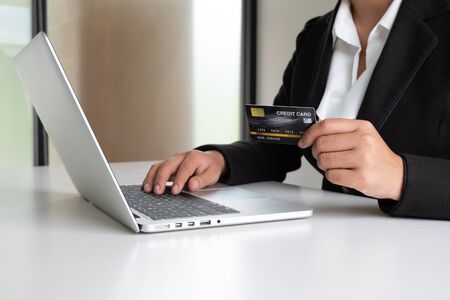 Business woman consumer holding credit card for online shopping and payment make a purchase on the Internet.の写真素材