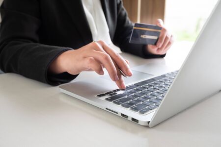 Business woman consumer holding credit card for online shopping and payment make a purchase on the Internet.の写真素材