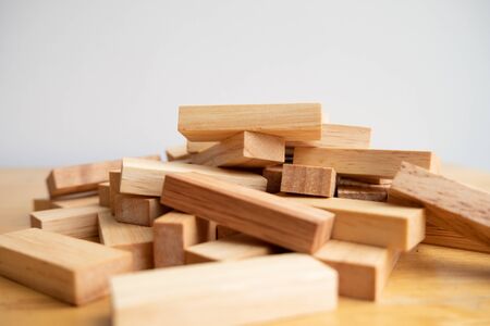 Wood block pile with architecture model, Concept Risk of management and strategy plan, growth...