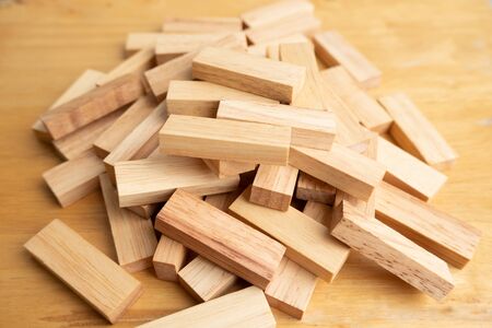 Wood block pile with architecture model, Concept Risk of management and strategy plan, growth business success process and team work.の写真素材