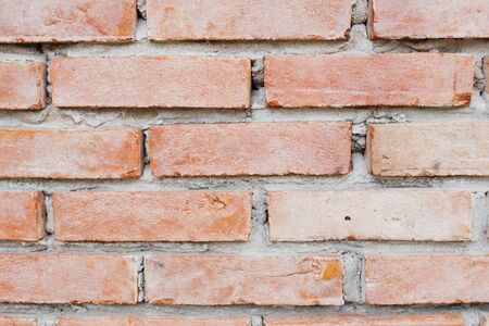Close up photo of a red brick wall background.の写真素材