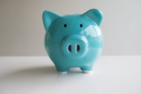 Blue piggy bank with white background, step up growing business to success and saving for retirement concept.の写真素材