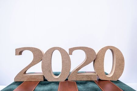 2020 wooden character on business bag, set new business goals with New Year 2020.の写真素材