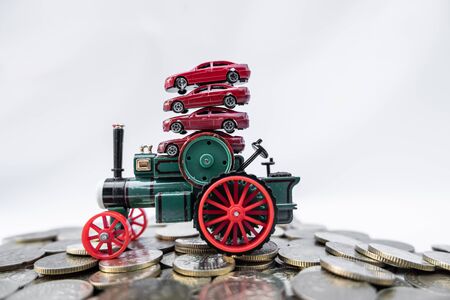 Toy cars with gold coins show To growth, saving money for car loans.