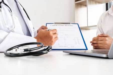 Female doctors who treat patients make an appointment to listen to the results after a physical...