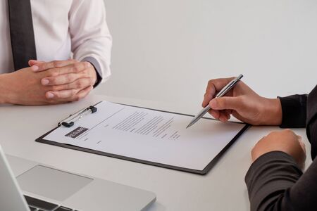 Business people hold a job profile and talk to job applicants for job interviews about careers and business concepts.の写真素材