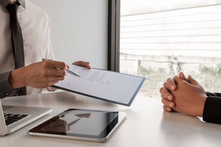 Business people hold a job profile and talk to job applicants for job interviews about careers and...