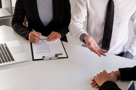 Company managers hold a resume, interviewing job applicants in large companies, business concepts,...