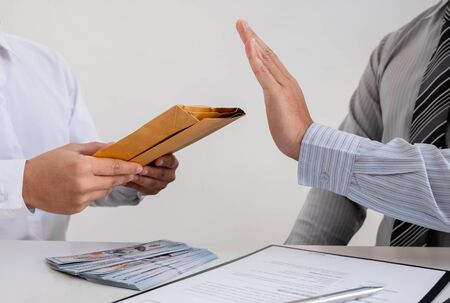 The businessman denies the money in envelope proposed by his partner to bribe the concept of bribery...