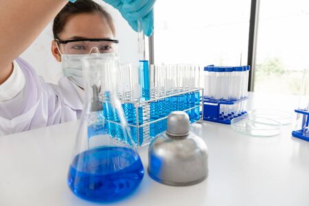 Medical scientists have experimented with liquid chemicals in vitro to analyze viral data in...