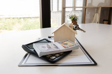Insurance form with sample of house and keys Home insurance concept.の写真素材