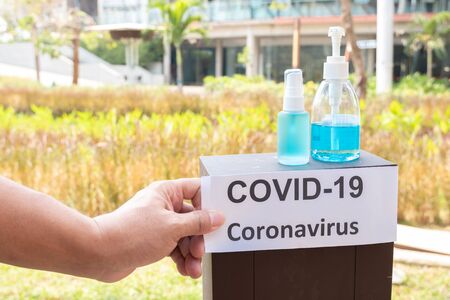 Young women hand holding a hand sanitizer to prevent virus infection Covid-19 protection device.