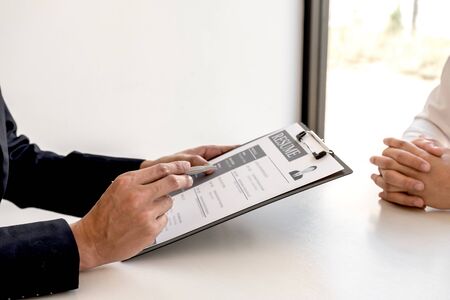 Business people hold a job profile and talk to job applicants for job interviews about careers and business concepts.の写真素材