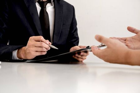 Business people hold a job profile and talk to job applicants for job interviews about careers and...