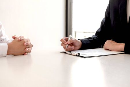 Business people hold a job profile and talk to job applicants for job interviews about careers and business concepts.の写真素材
